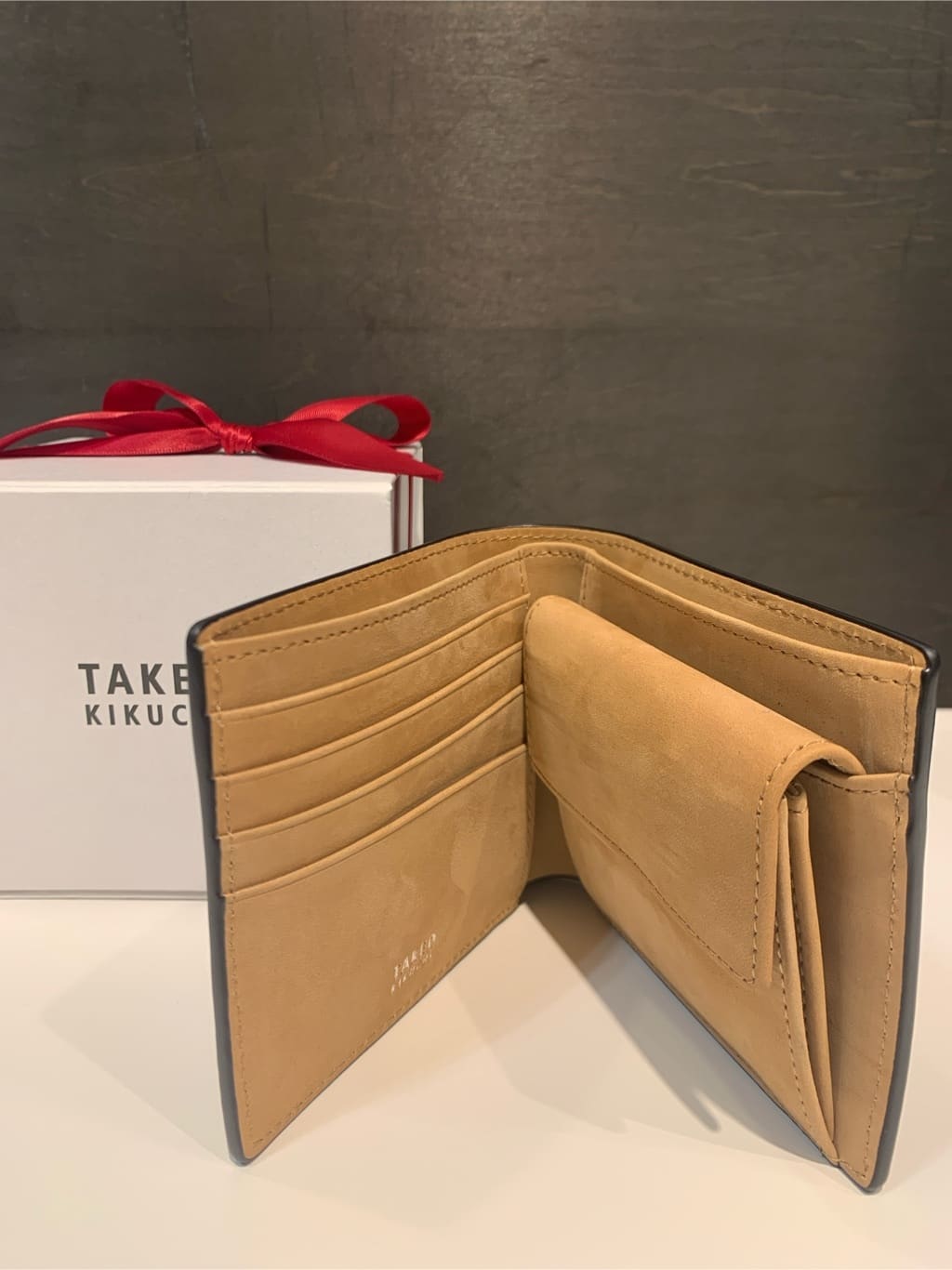 木村剛さんの「TAKEO KIKUCHI｜【ソフト＆ナチュラル】ミニメッシュ レザー 2つ折り財布」を使ったコーディネート