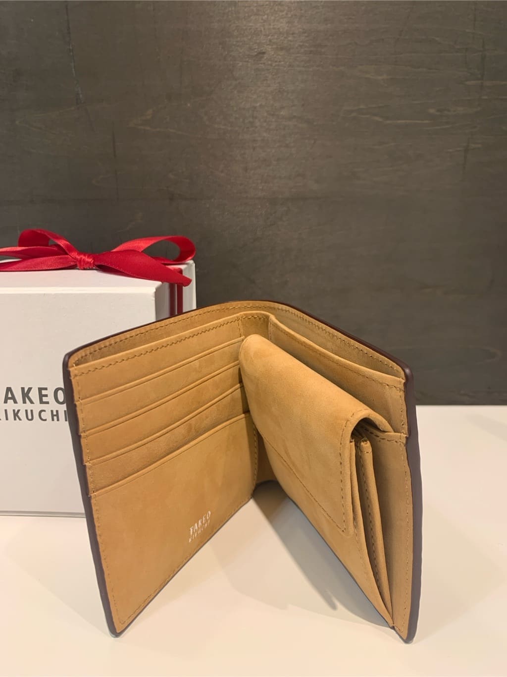 木村剛さんの「TAKEO KIKUCHI｜【ソフト＆ナチュラル】ミニメッシュ レザー 2つ折り財布」を使ったコーディネート