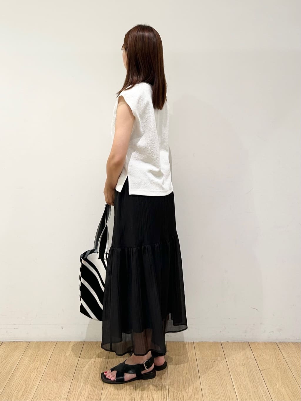 kozueさんの「INDIVI｜【2点セット／着回し◎】ノースリーブ＆ティアードスカート カセット服」を使ったコーディネート