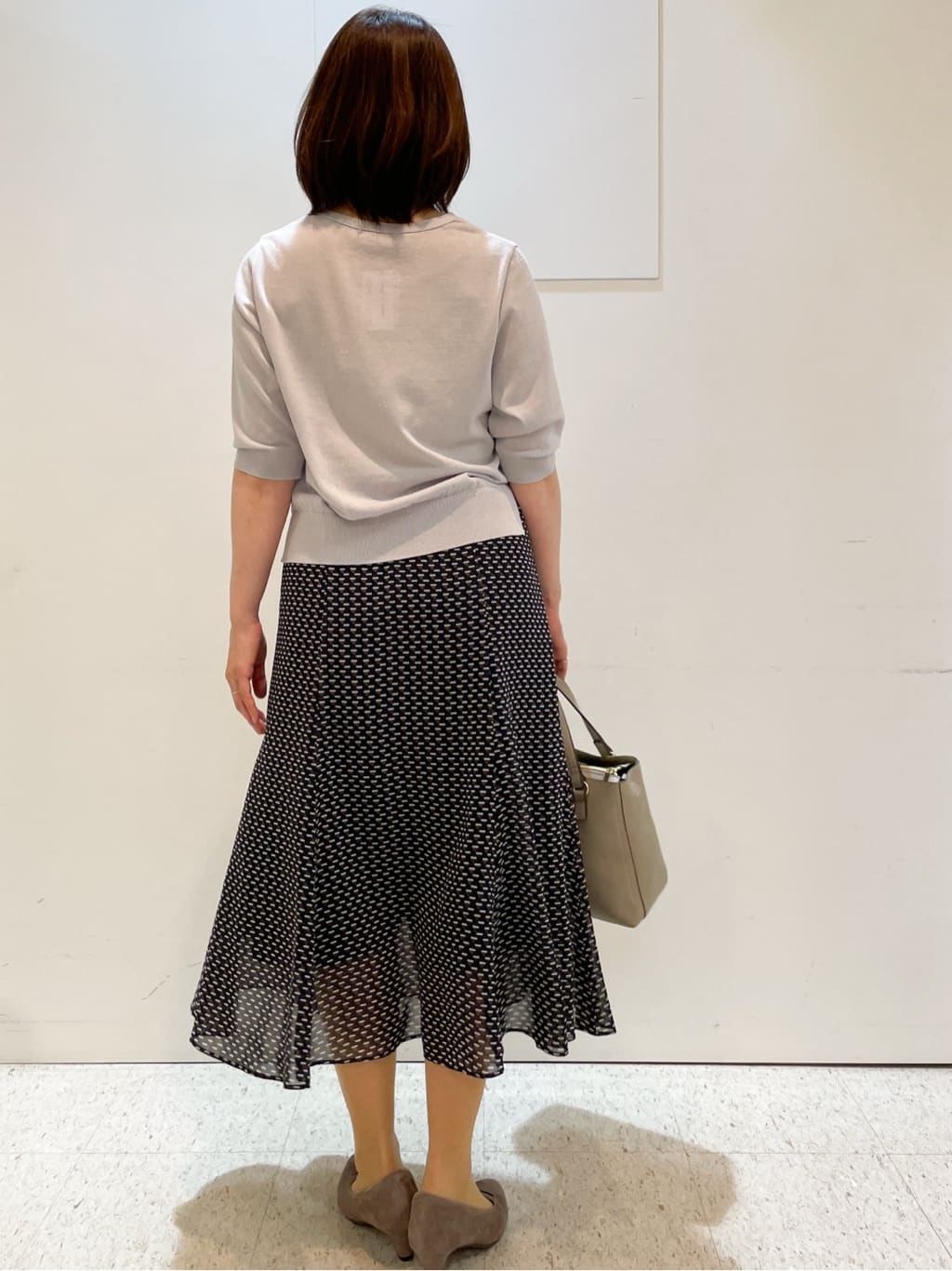 めいさんの「Reflect｜【WEB先行カラーあり／マシンウォッシュ可／ウエスト総ゴム】コツキ幾何柄ロングスカート」を使ったコーディネート