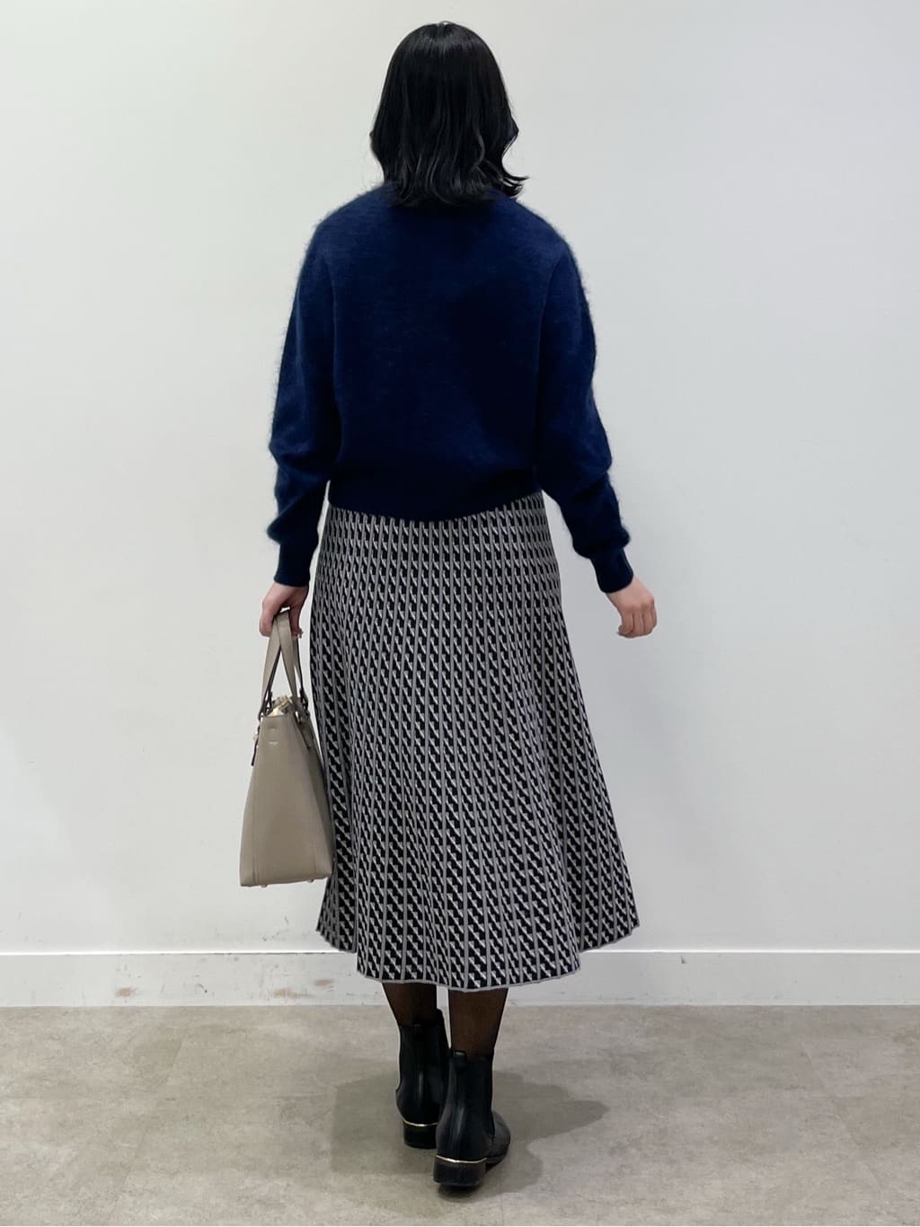 yukariさんの「Reflect｜【WEB先行カラーあり／セットアップ可】幾何調柄ニットスカート」を使ったコーディネート