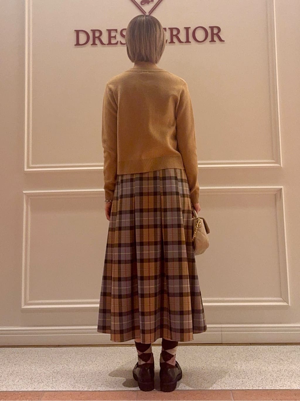 renaさんの「DRESSTERIOR｜◆チェックタックソフトプリーツスカート」を使ったコーディネート