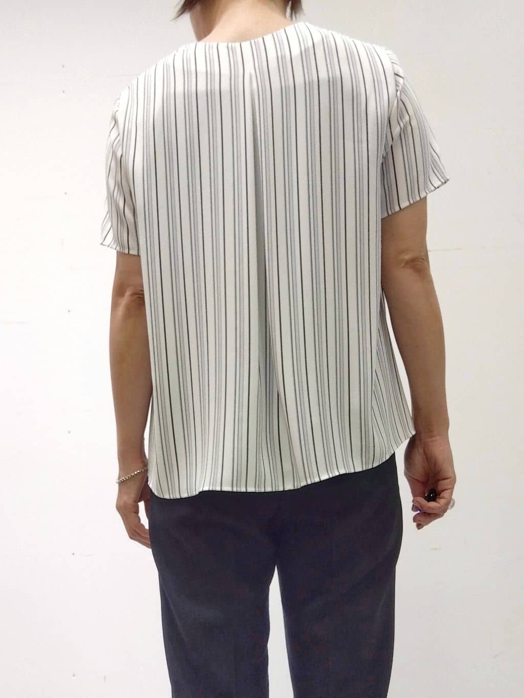 Kさんの「INDIVI｜【定番スーツ／UVケア／洗える】ウール調タックテーパードパンツ」を使ったコーディネート