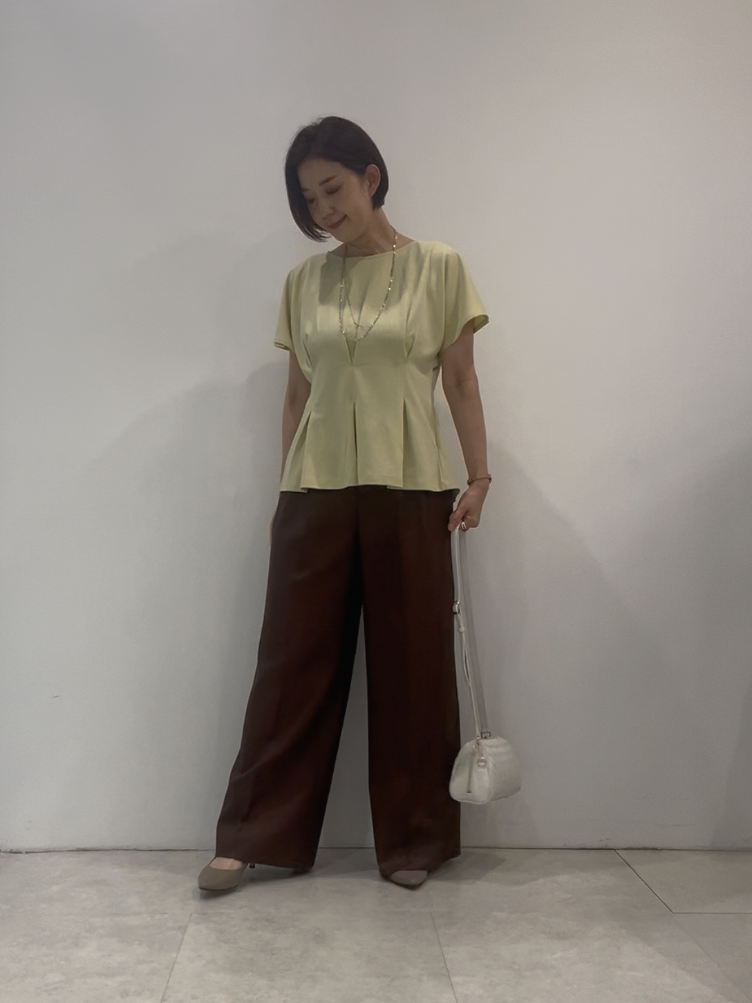 まどかさんの「UNTITLED｜【UVカット／接触冷感／吸水速乾】タックデザインフレアトップス」を使ったコーディネート