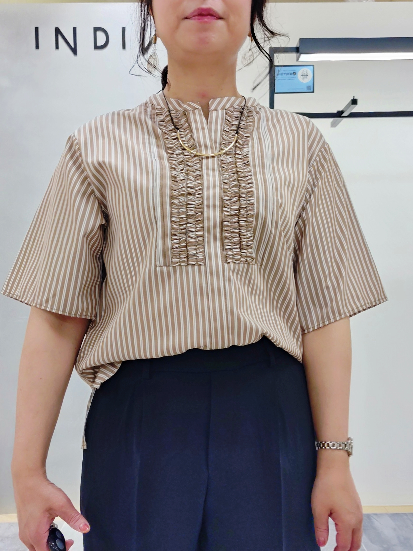 TOMOMIさんの「INDIVI｜【洗える／UVケア／SETUP可】着る日傘ワイドパンツ」を使ったコーディネート