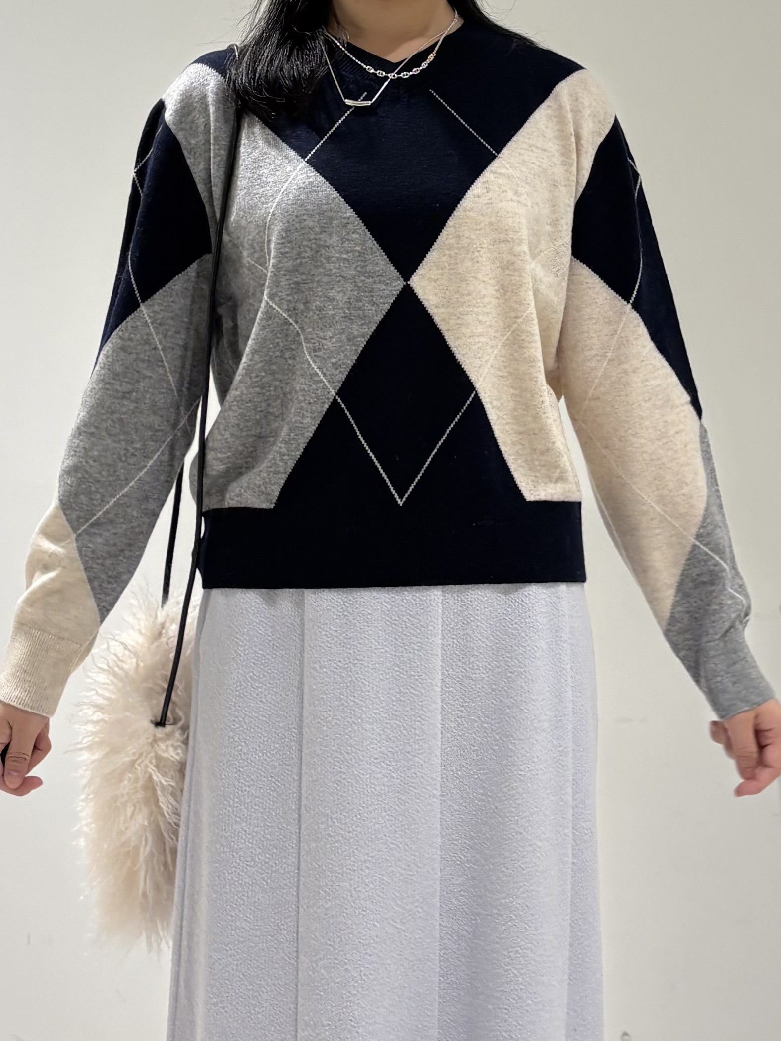 momokoさんの「INDIVI｜【ウール混】ビッグアーガイル柄ニット」を使ったコーディネート